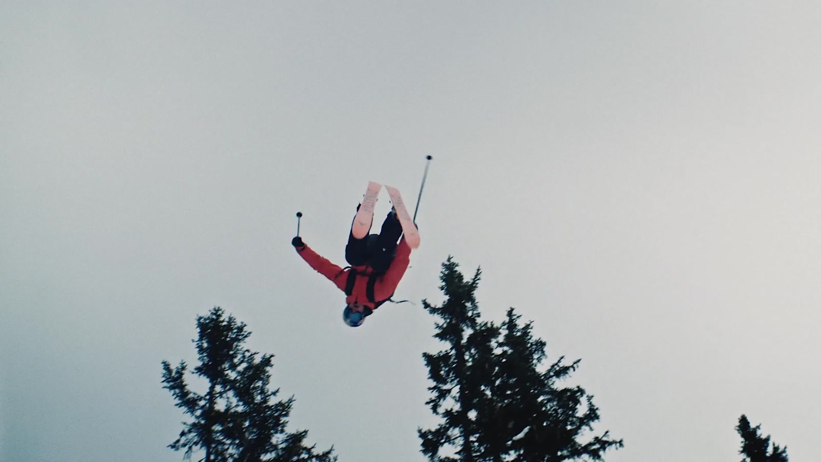 Richard Permin inverted in mid-air above a frosted forest in Fastwood
