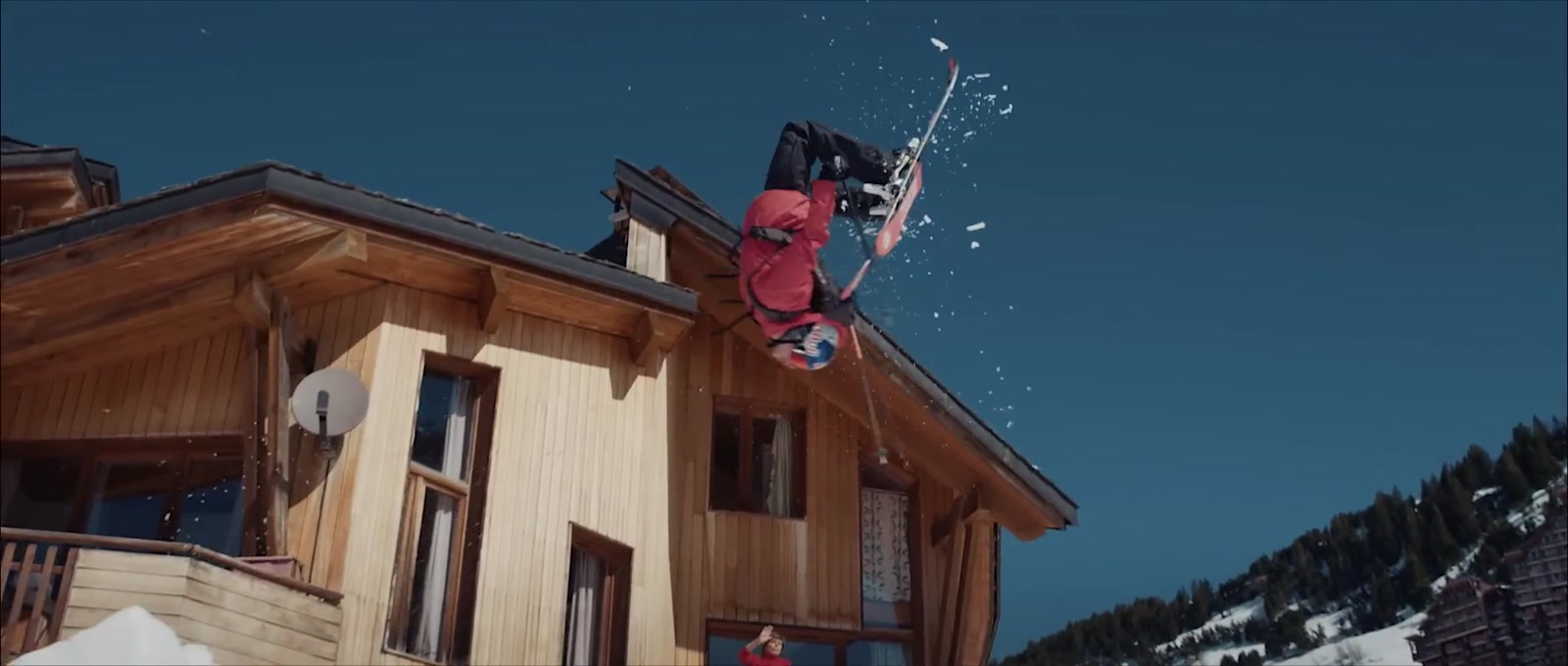 Skier dropping off a rooftop in Avoriaz