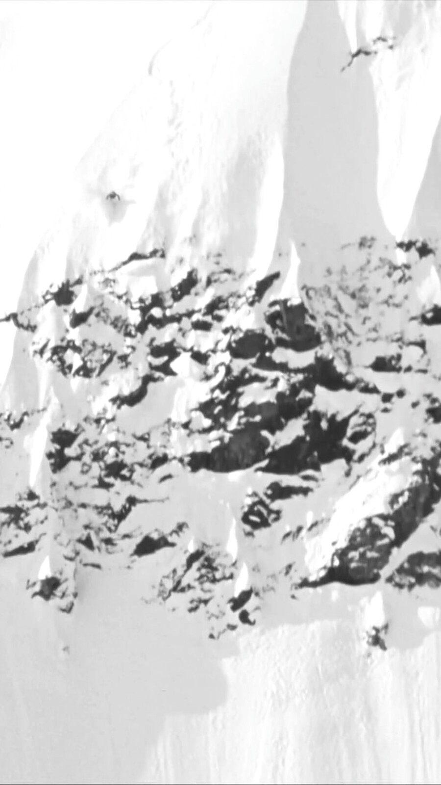 A snow-and-rock alpine face read as a study in precision