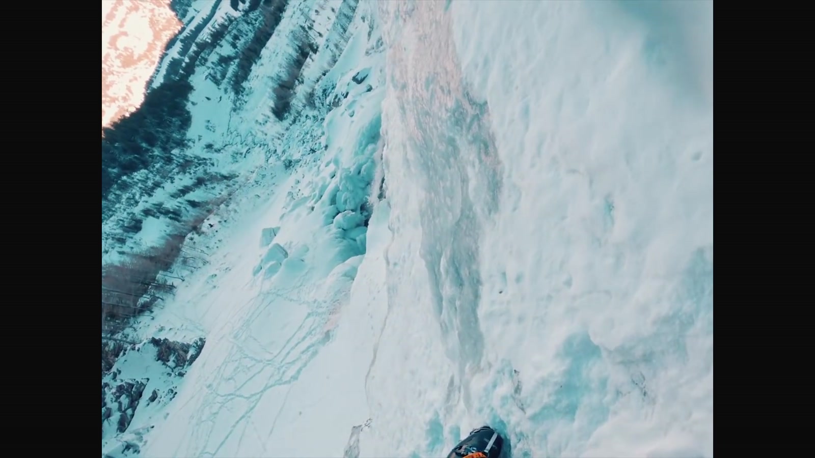 Steep blue glacier ice and spine terrain at altitude